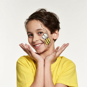 Final step, Adding sparkles and dots around the design with white and silver sparkle paint using a fine brush to complete bee face paint.