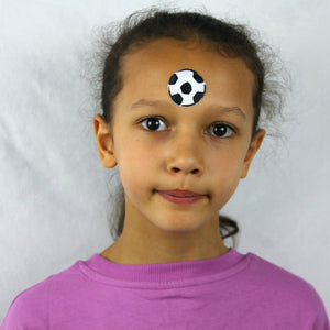 Step one, painting a football using black and white paint in the centre of the forehead.
