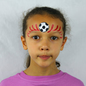 Step two, using red paint, adding flicking lines from the centre of the forehead on both sides.