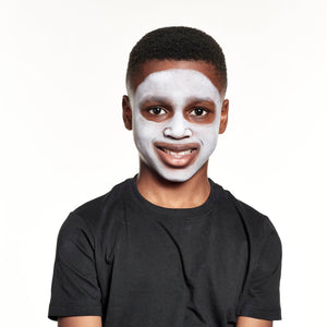 Step one, showing the start of creating white base all over face.