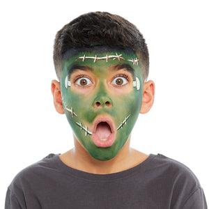 Final step, Using bright red paint to go over the scars, black paint to outline the side of the mouth, and adding a spiky black hair fringe to the forehead to complete Frankenstein face paint.