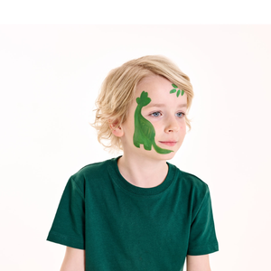 Paint a dark green dinosaur body and head on the side of the face, adding leaves to the forehead