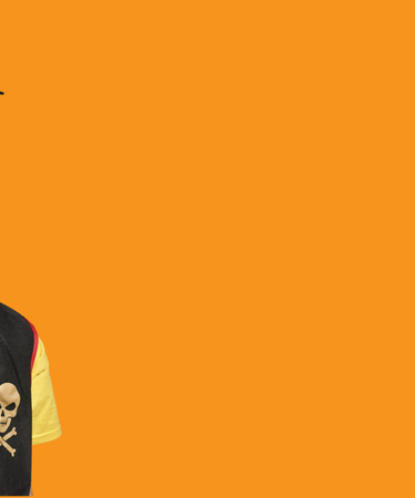 Three children with face paint and superhero masks on an orange background