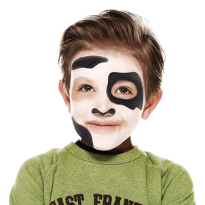 Step two, using black face paint to add patches around eyes, forehead and jaw.