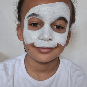 Step one, Creating a half skull shape with white, leaving spaces for the eyes, and filling in with the same paint colour.