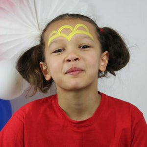 Step one, showing the start of creating two yellow arches over the eyebrows followed by three arches above them.