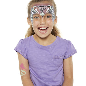 Final step, adding silver scales to the forehead and cheeks, fuchsia circles below the shell, and black and white highlights to complete the Mermaid face paint.