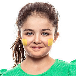 Step one, showing the start of creating horizontal rectangle on each cheek with yellow face paint.