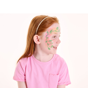 Paint green leaves around the eye and cheek