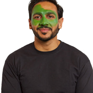 Sponge a green base over the face and one side of the forehead.