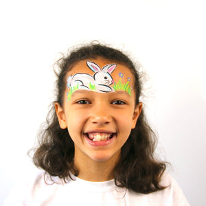 Final step, adding grass and flowers to complete the Easter Bunny face paint.