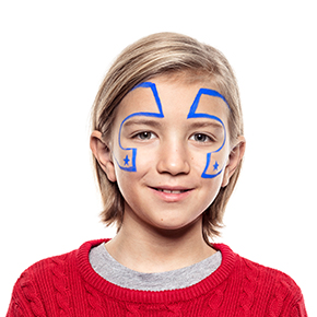 Boy with step 1 of Superhero face paint design