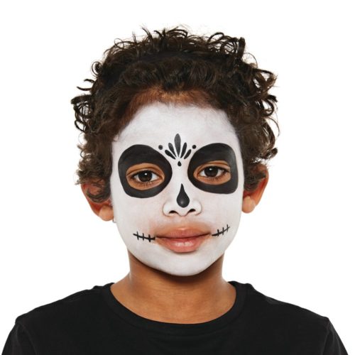 Boy with step 1 of Sugar Skull face paint design