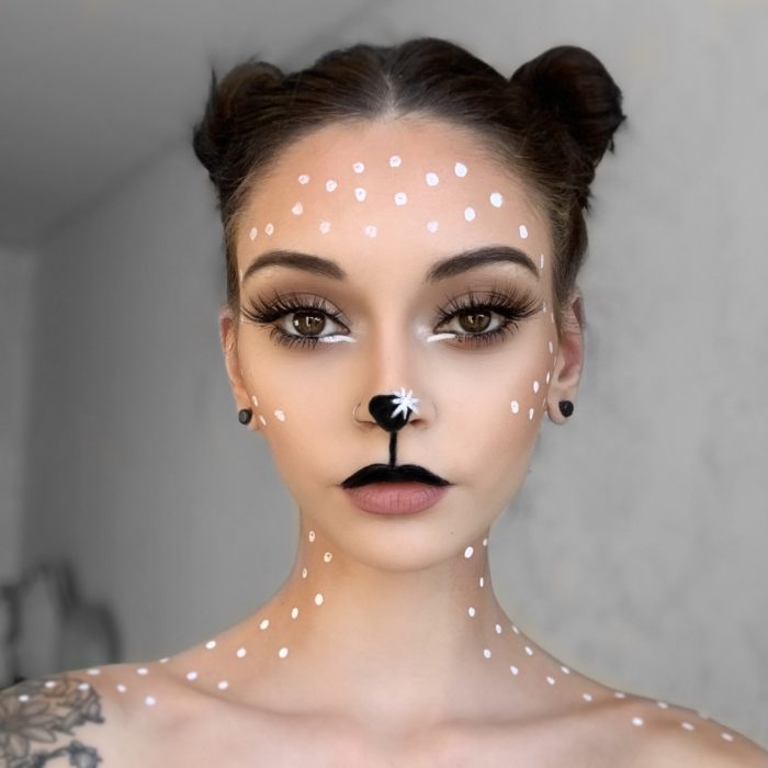 girl with step 3 of Reindeer face paint design. Christmas costume and face paint ideas