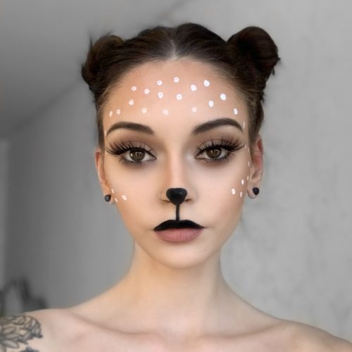 girl with step 2 of Reindeer face paint design. Christmas costume and face paint ideas