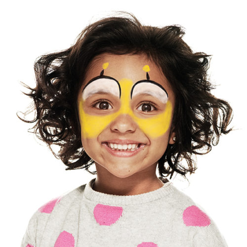 girl with step 2 of Bee face paint design