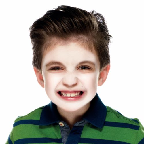 Boy with step 1 Vampire face paint design
