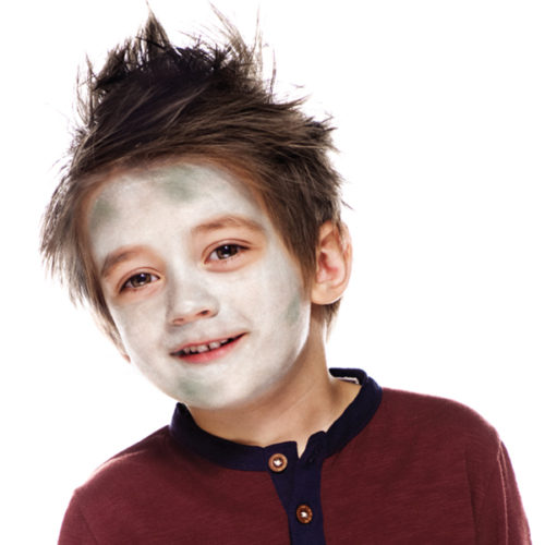 Boy with step 1 of Zombie face paint design