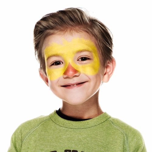 boy with step 1 of Chick face paint design