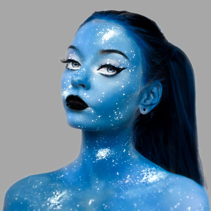 girl with Cosmic Galaxy face paint design