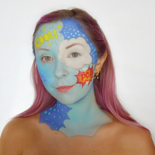 girl with step 2 of Classic Pop Art face paint design