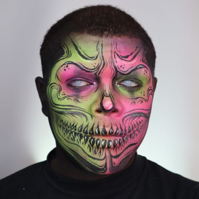 Boy with Neon Skull face paint design for Halloween