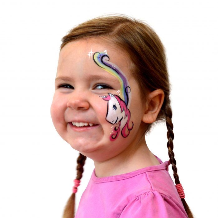 Girl with kids unicorn face paint. Step 3 of a 3 step guide.