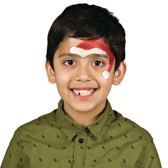 Boy with Santa face paint design for Christmas