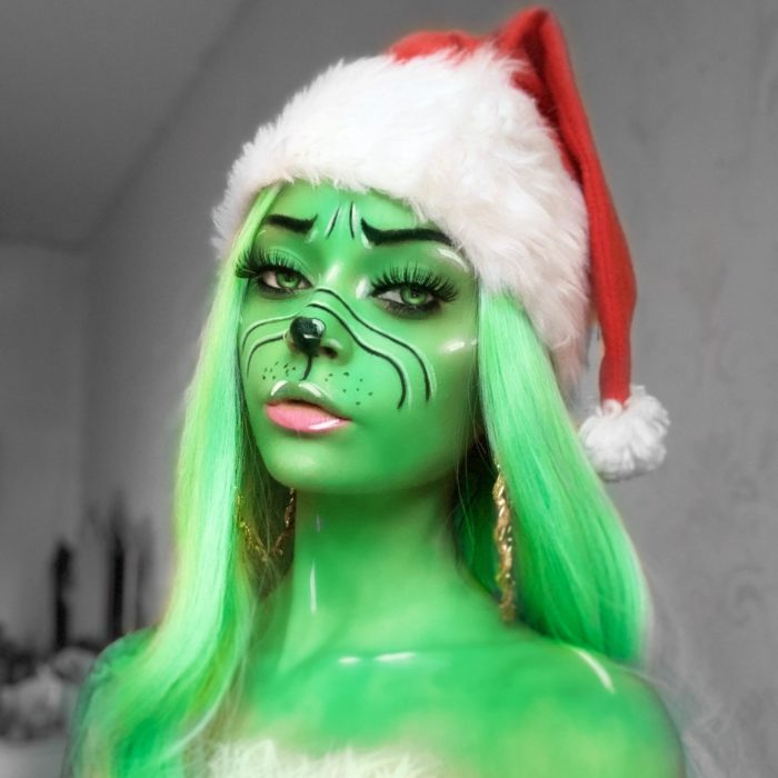 girl with Miss Grinch face paint design for Christmas