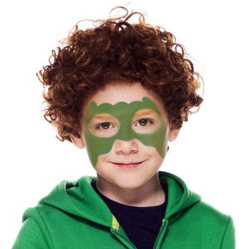 Boy with step 1 of Dinosaur Boy face paint design