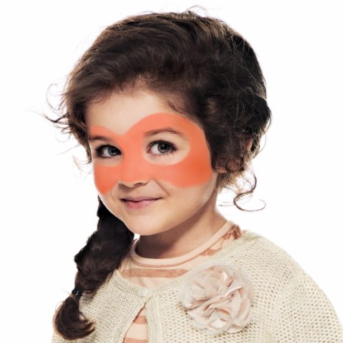 girl with step 1 of Halloween Pumpkin face paint design