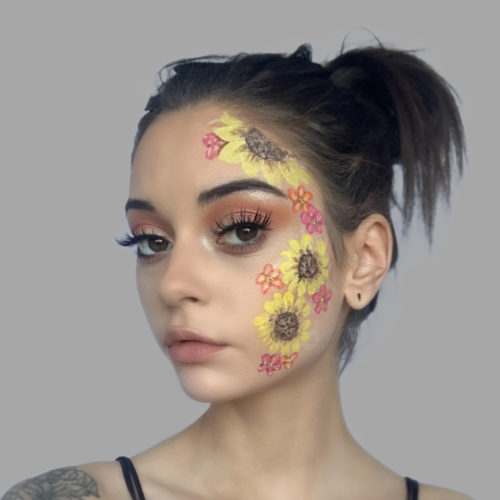 girl with step 2 of Sunflowers face paint design