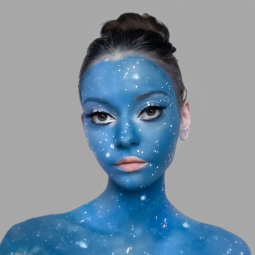 girl with step 2 of Cosmic Galaxy face paint design