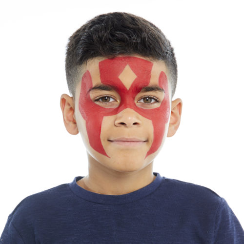 Boy with step 1 of Super Warrior face paint design